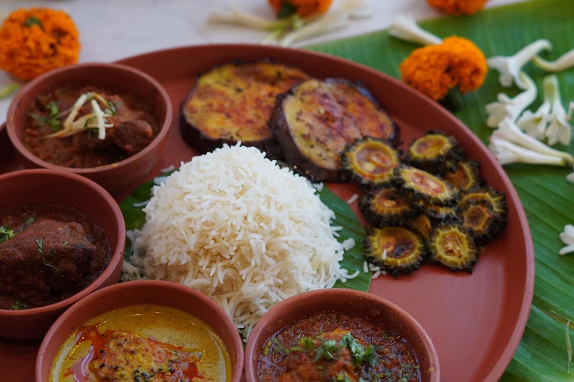 Radisson Red Chandigarh Mohali Exterior photo A traditional Bengali meal
